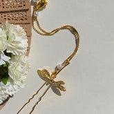 Horquilla en forma de U con forma de libélula de la Antigüedad